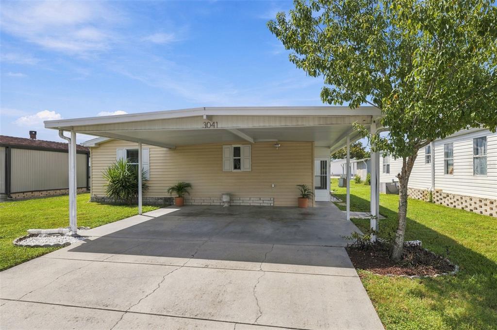 Welcome to 3041 Short Leaf St in Wesley Chapel! 3 bed / 2 bath home with large carport and driveway!