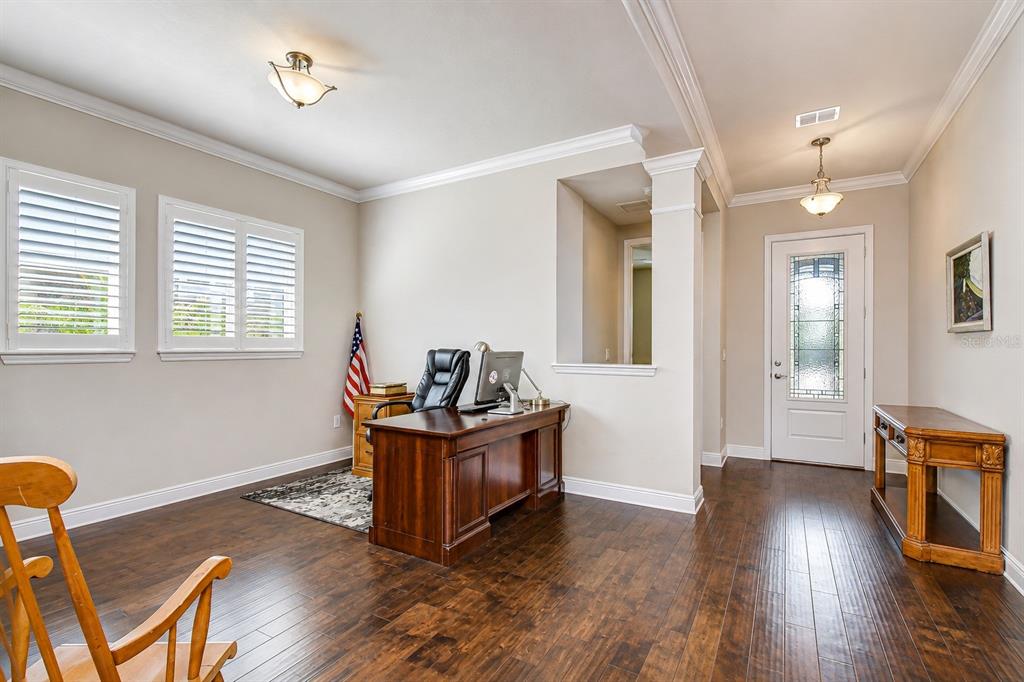 Versatile space ideal for a home office, formal sitting room, hobby room, or media room.