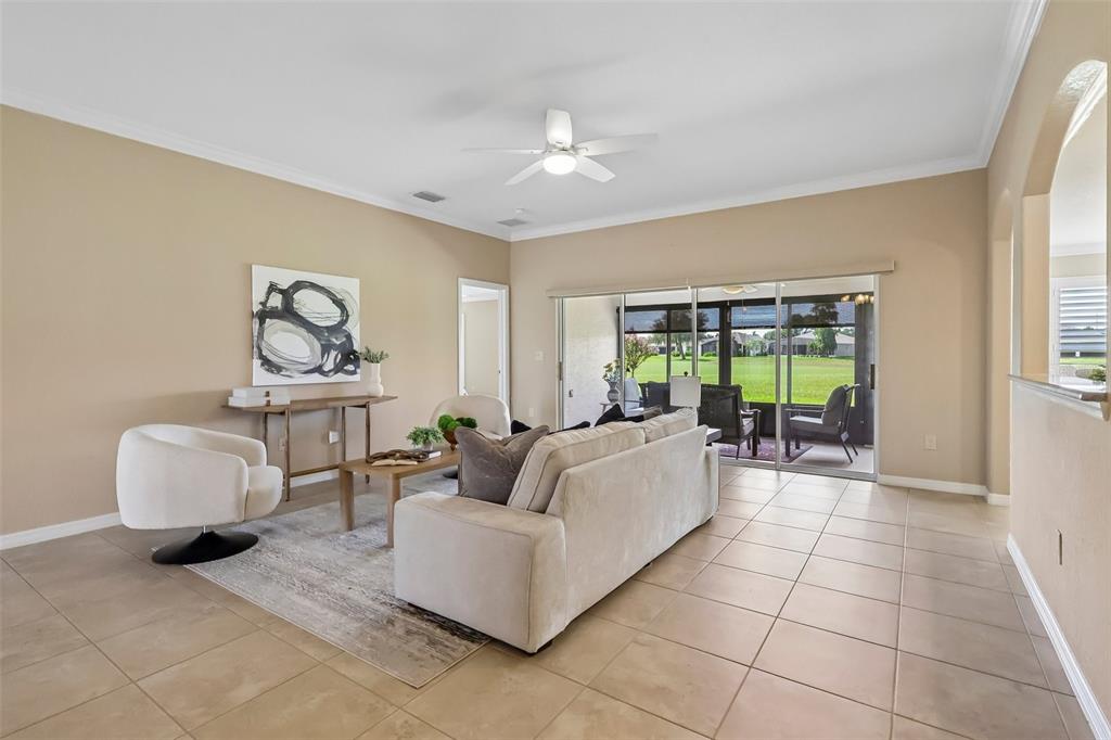 Oversized sliding glass doors open up an enclosed lanai for indoor/outdoor Florida living.