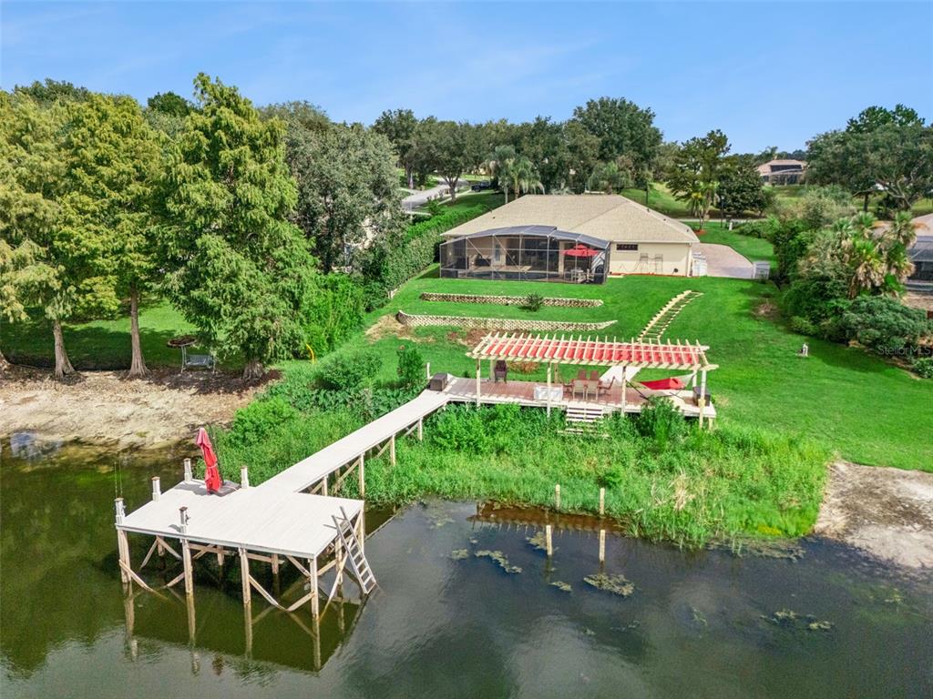 Aerial view of property with dock