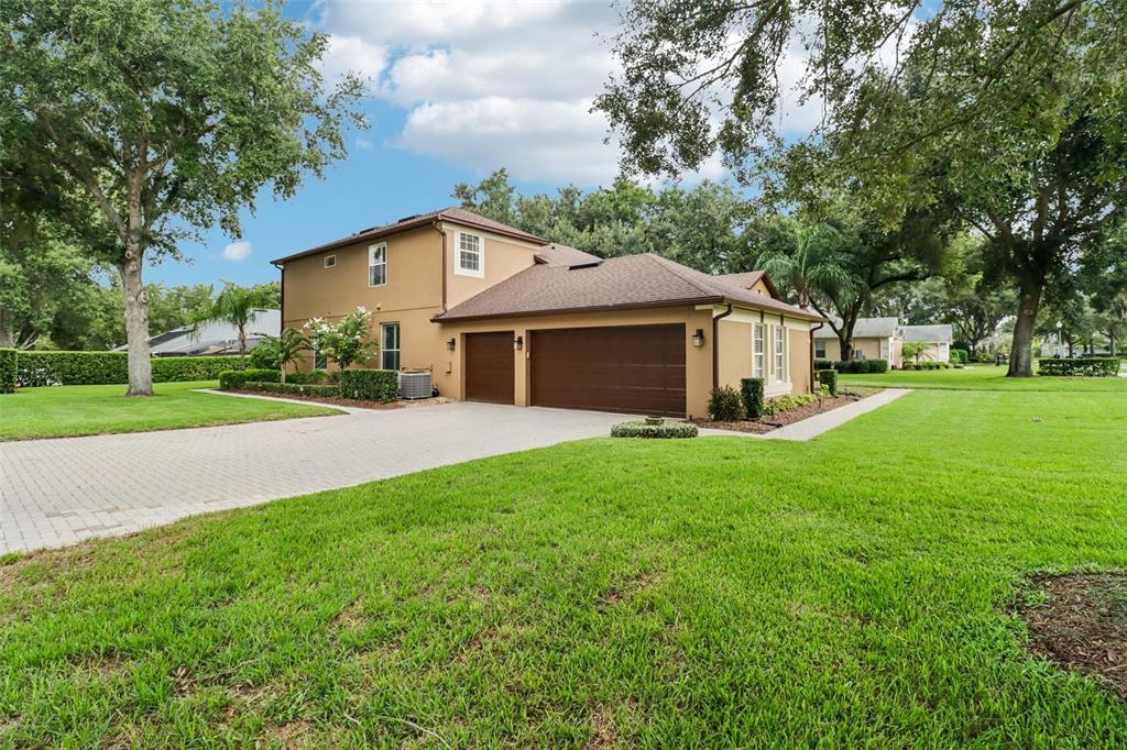 Oversized corner lot with a 3-car side facing garage.