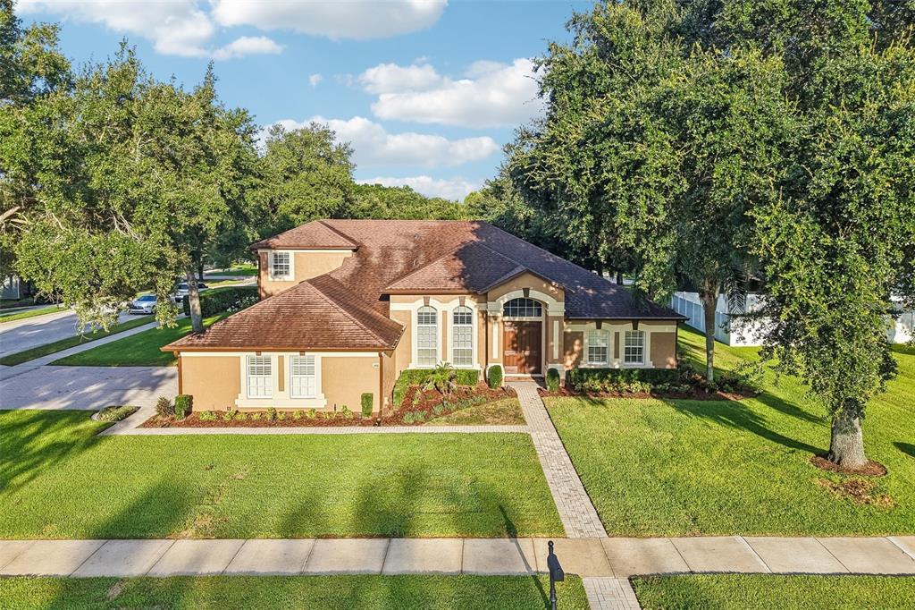 Welcome to one of Wekiva Run's most sought-after floor plans, offering exceptional space, flexibility, and timeless style on a beautifully landscaped .36 ACRE CORNER LOT!