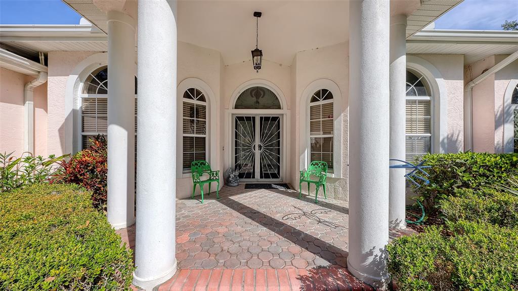 A Beautiful, Columned, Covered, Double Door Entry Greet you