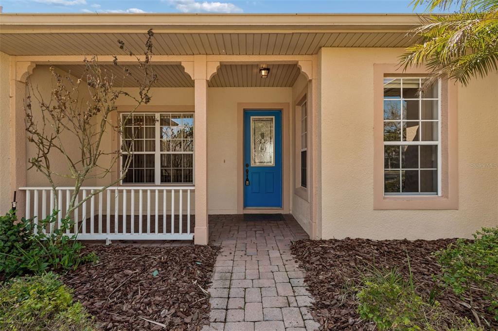 Entry porch with leaded glass door.