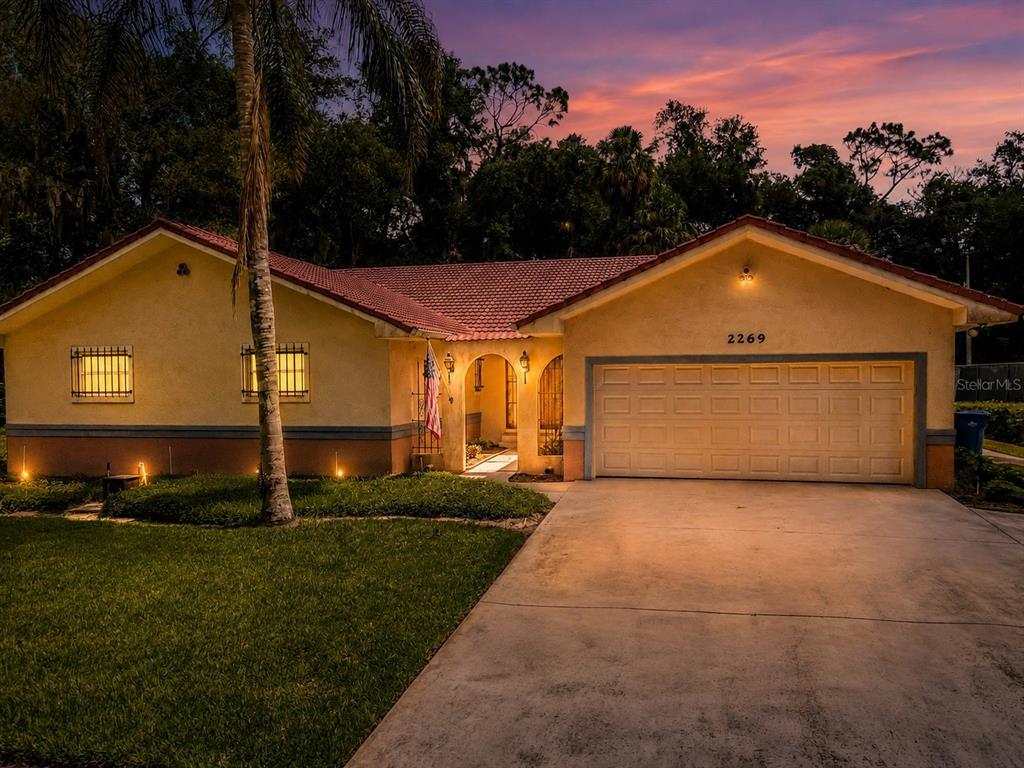 Spanish style ranch home with courtyard entry
