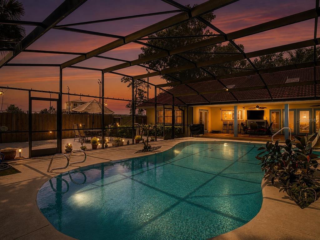 backyard oasis, screened pool and covered lanai, turf patio.