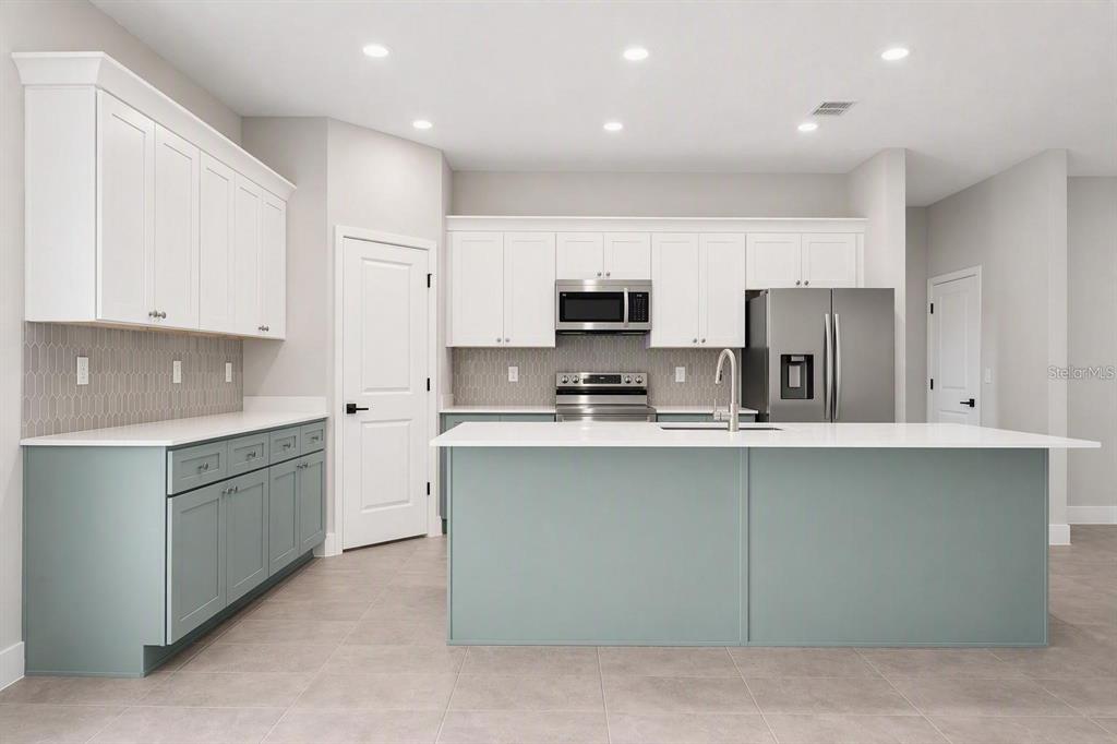 Photo is of a completed model; actual finishes and colors may vary
