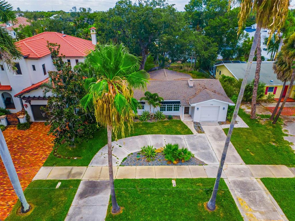 Tree lined streets and the convenience of sidewalks on this deep property.