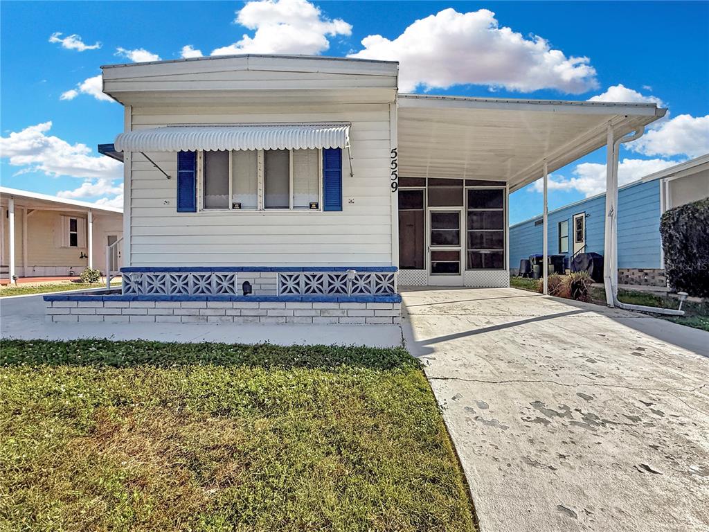 Front of Home with Carport Driveway
