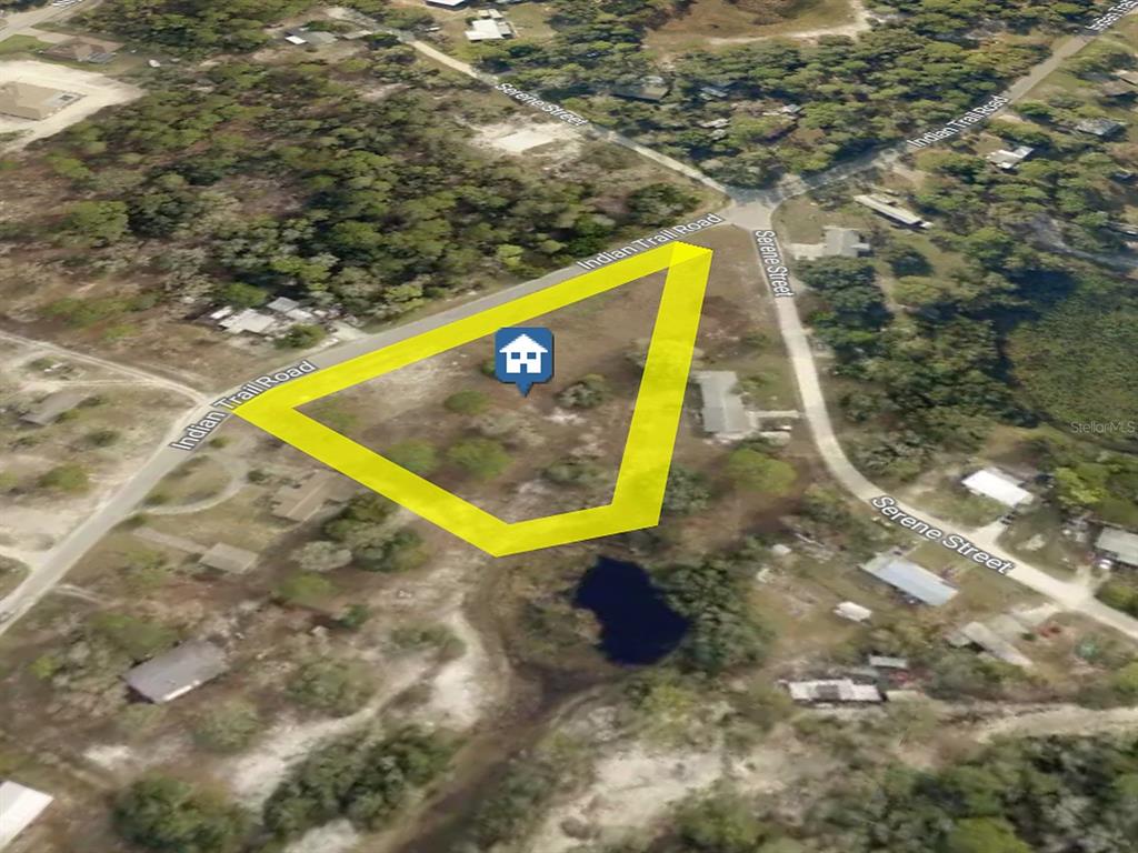 Alternate aerial perspective showing the parcel and frontage along Indian Trail Road. Boundaries are approximate.