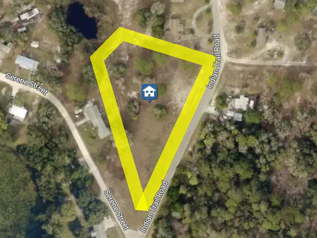 Aerial view of the 1.75-acre parcel outlined in yellow. Property boundaries are approximate.