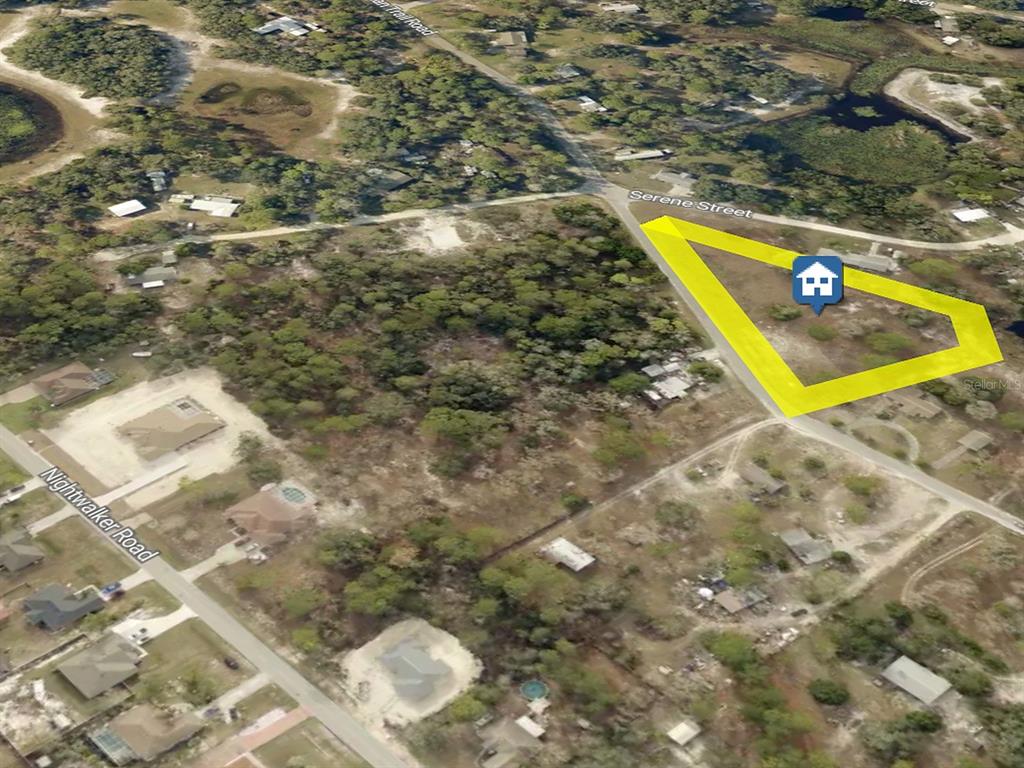 Wide aerial view showing the parcel’s location and surrounding neighborhood. Boundaries are approximate.