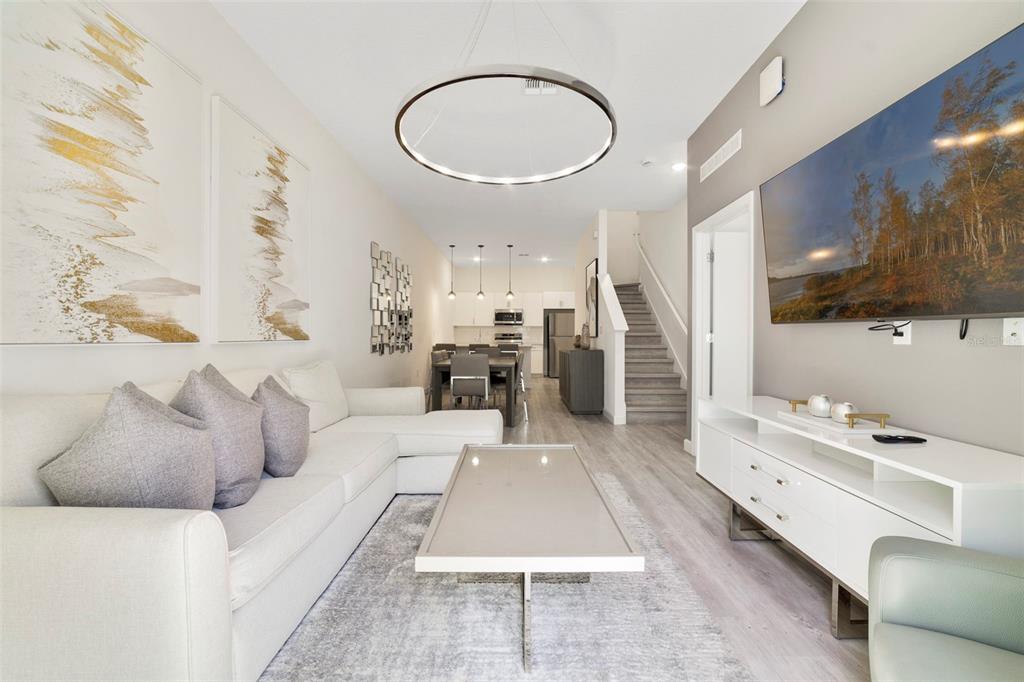 Open concept main floor filled with upgraded finishes and fixtures.