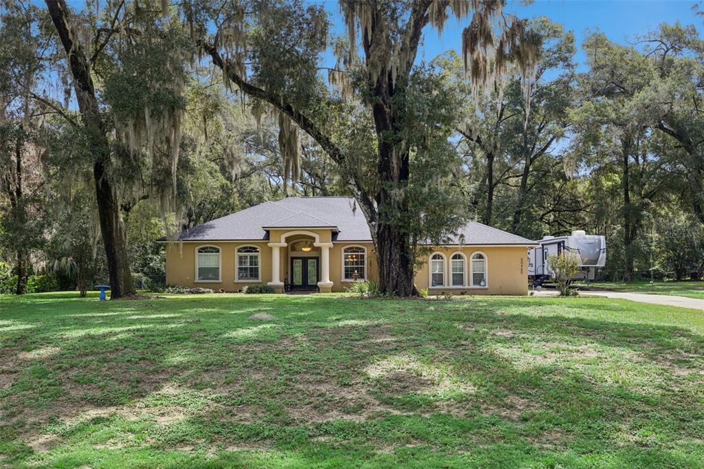 Wide front view showcases the home and spacious 1.14-acre homesite.