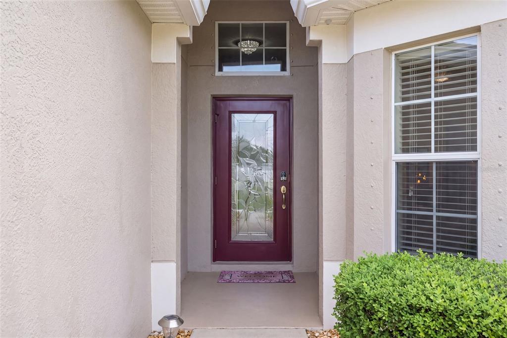 Gorgeous glass front door with transom!