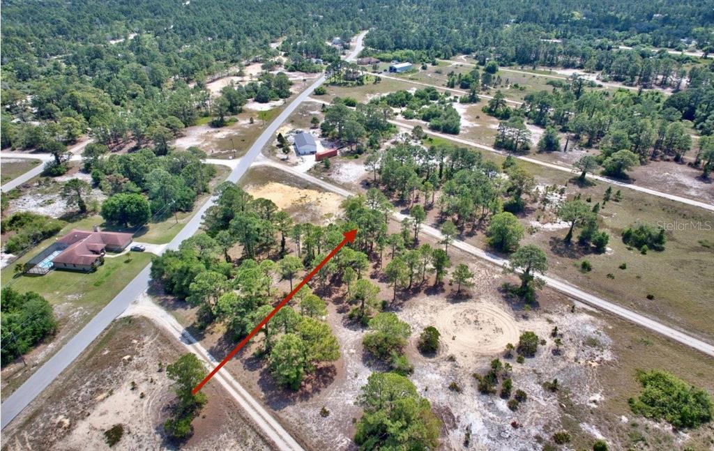Arrow is approx location. Buyer recommended to have survey done for exact boundary lines