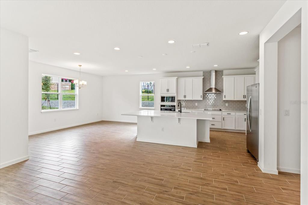 The sample photos included are of the model home and are meant to showcase the craftsmanship and design quality.