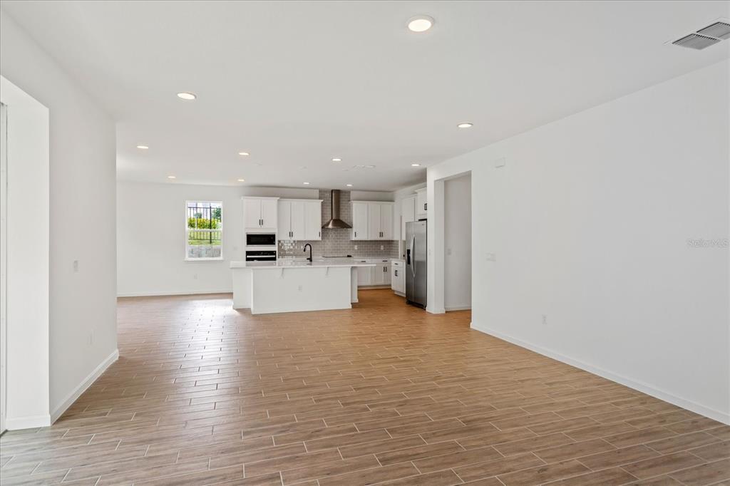 The sample photos included are of the model home and are meant to showcase the craftsmanship and design quality.