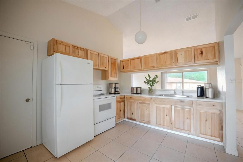 Kitchen with newer cabinets. Virtually staged.