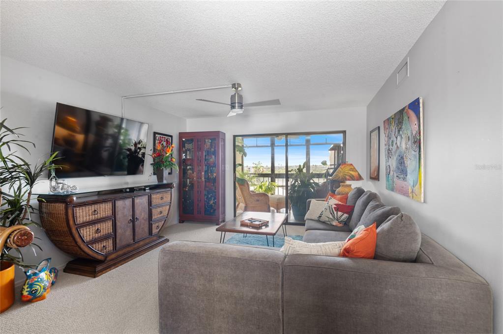 Living room with slider tobeautiful lanai