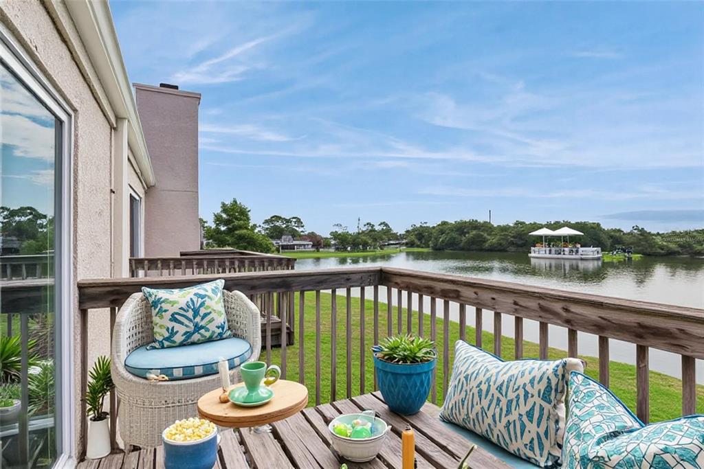 Second Floor Patio with view to the pond - Virtually Staged
