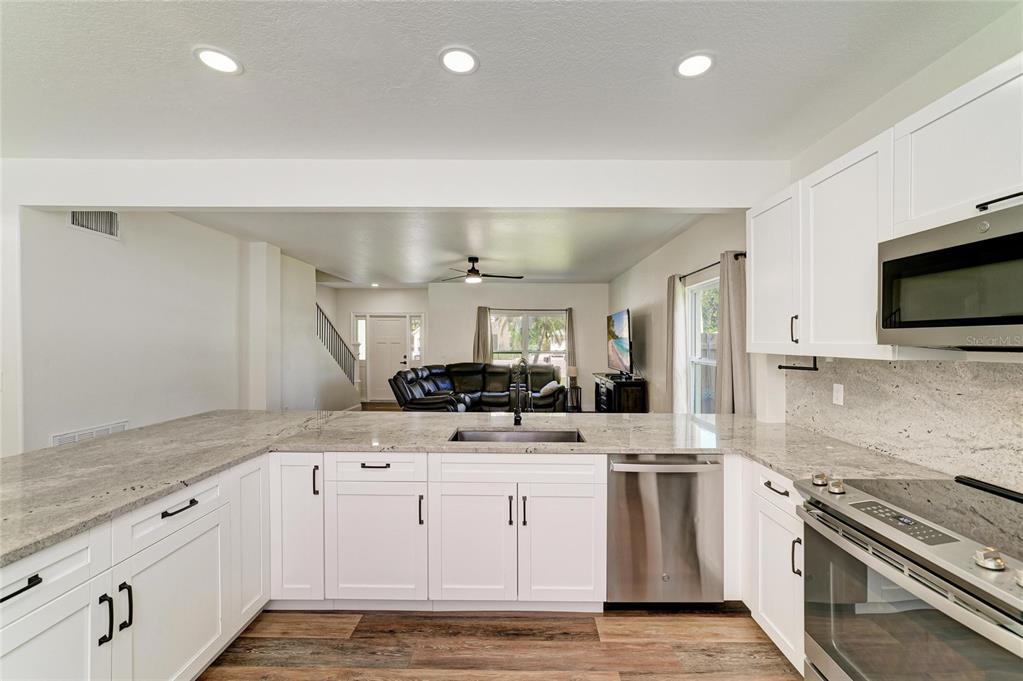 Soft close cabinetry, stainless steel appliances, and granite counters.
