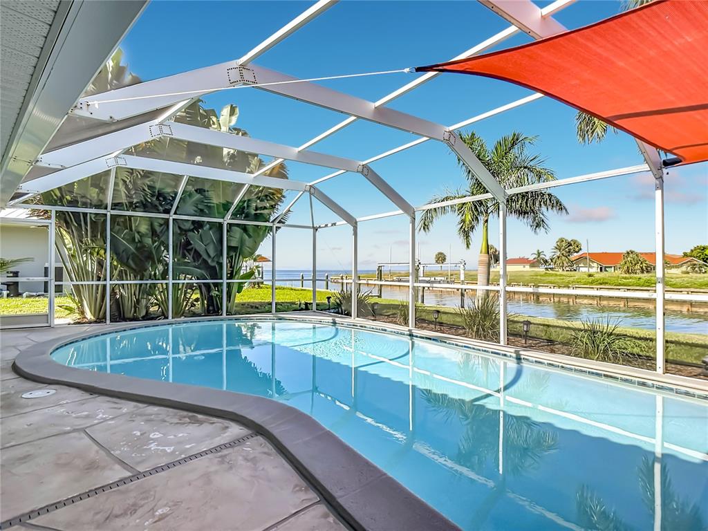 Screened Pool – Spacious screened in-ground pool and pool deck offering a private outdoor area for relaxing and entertaining.