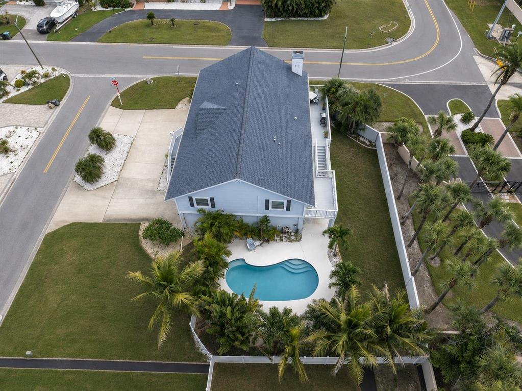 This spacious home is situated on a generously sized lot, with a circular driveway providing convenient access & ample room for additional vehicles.