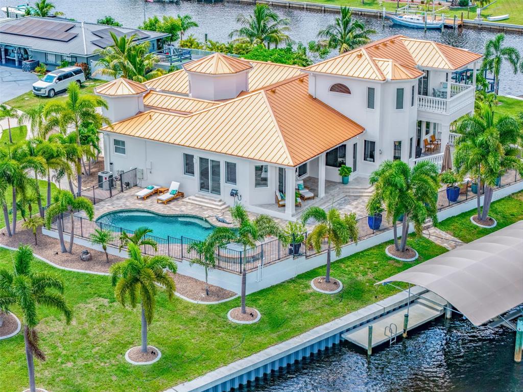 Aerial view Showcasing the Home's Impressive Waterfront Setting and Private Dock