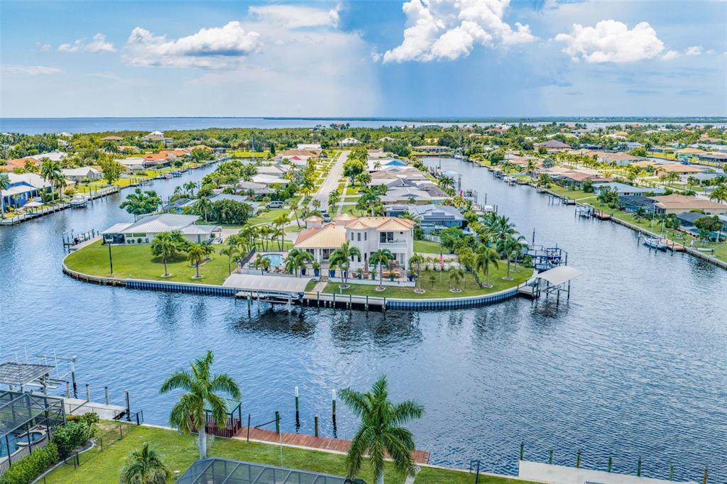 Stunning Aerial Highlighting Pool, Outdoor Living Areas and Waterfront Access
