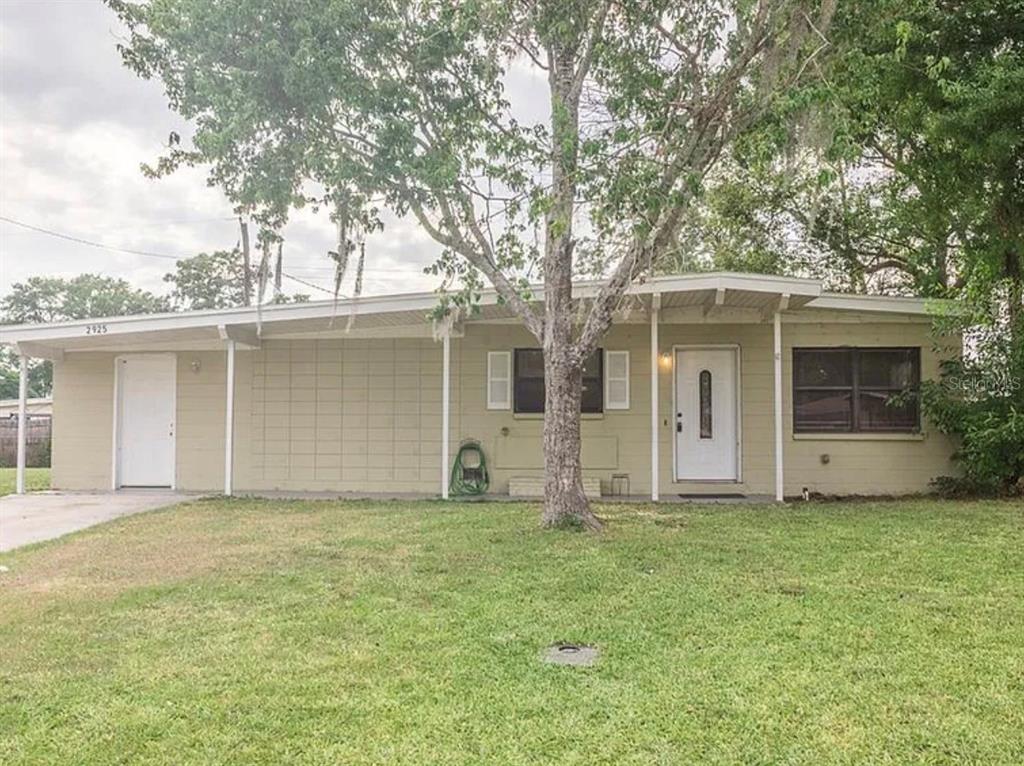 Front Exterior of 4-bedroom, 2-bathroom home with covered proch