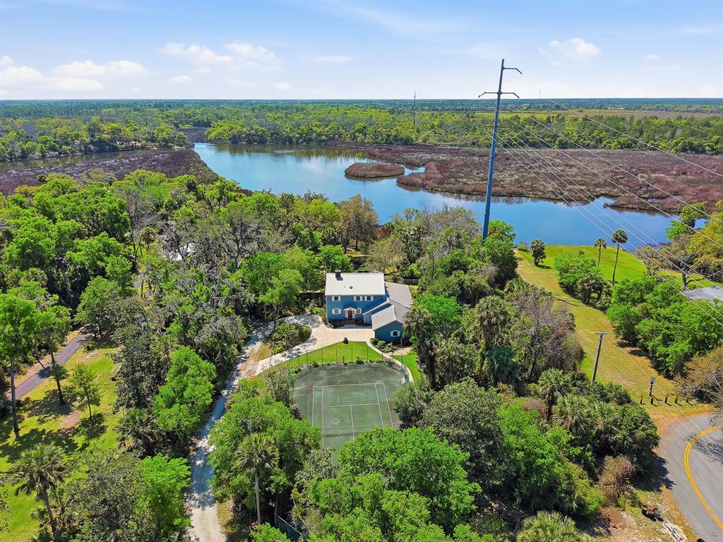 112 feet of Spruce Creek frontage!