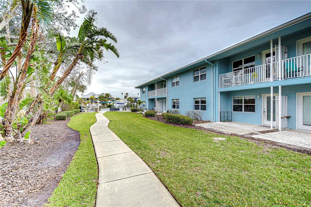 Back Exterior with Walkway to Water