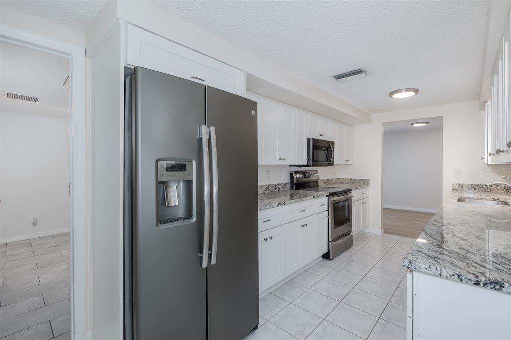 Galley Kitchen with Granite