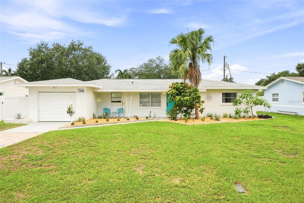 Oversized lot, large driveway and garage.