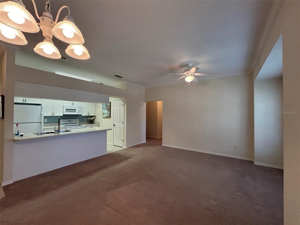Dining view into Kitchen and Living