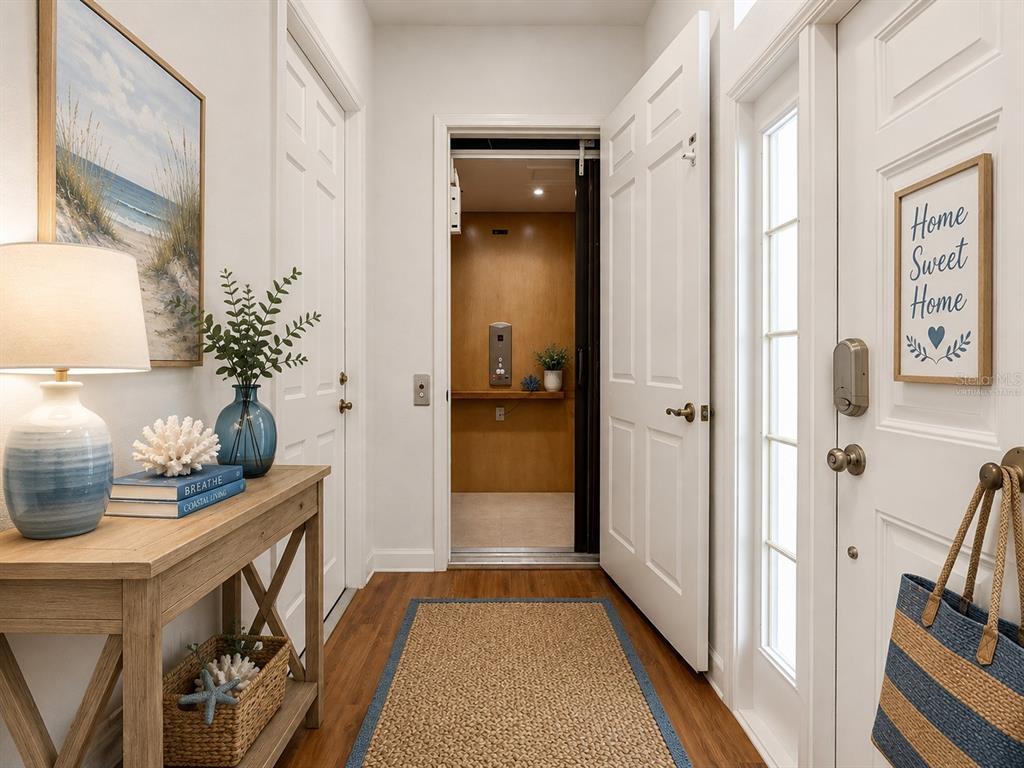 Garage door and Front Door entrance -  Elevator Access - virtually staged