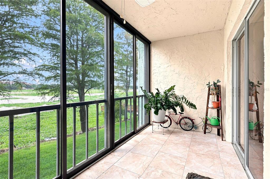 Screened lanai looking out at Lake Parker