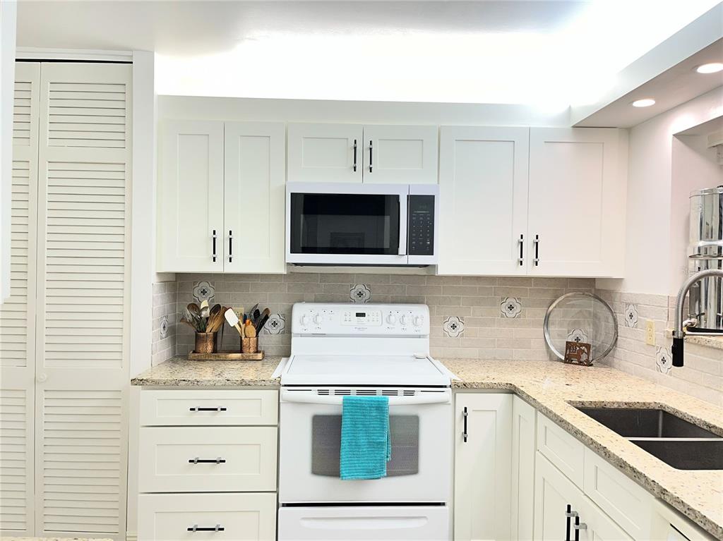Property for sale at 100 BLUFF VIEW DRIVE UNIT 211A, BELLEAIR BLUFFS, FL, 33770