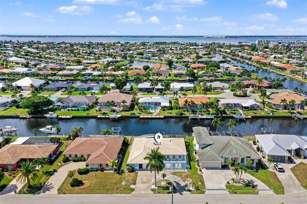 Your dream waterfront setting only 6-8 minutes to open water (looking north at canal system and view of Peace River meeting Charlotte Harbor)