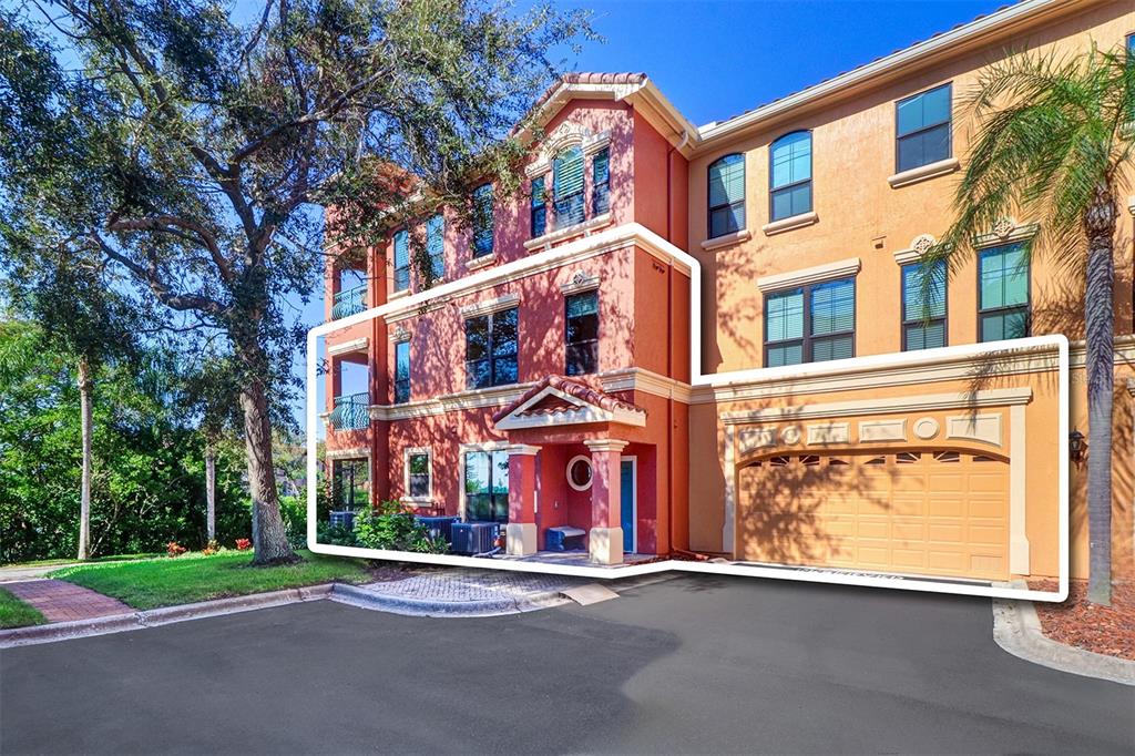 Front view #2/highlighted area shows the two story townhome with attached double car garage