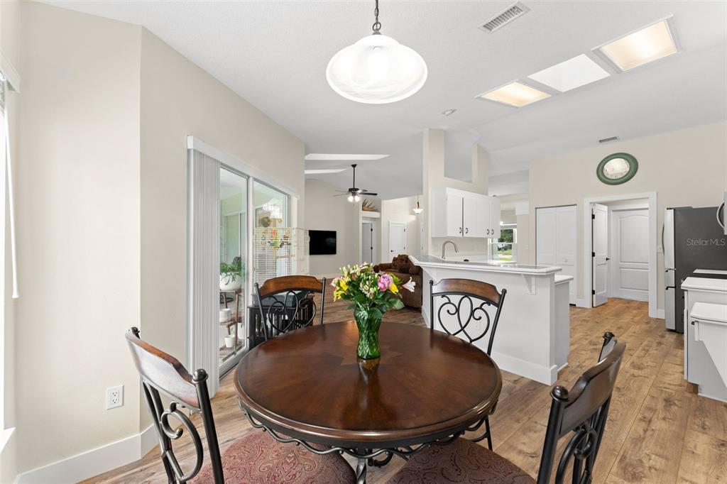 Breakfast nook views to the kitchen and living areas.