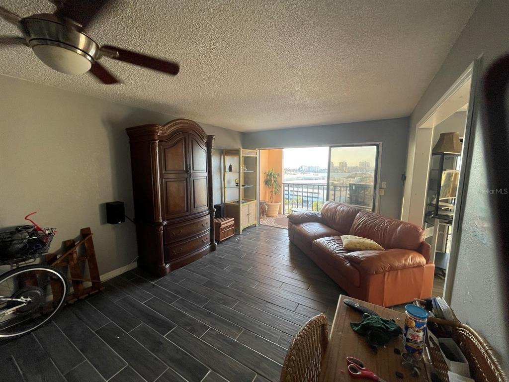 Open living area with wood-look tile flooring